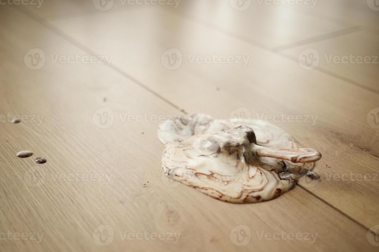 ice cream melting and spilling on floor , photo