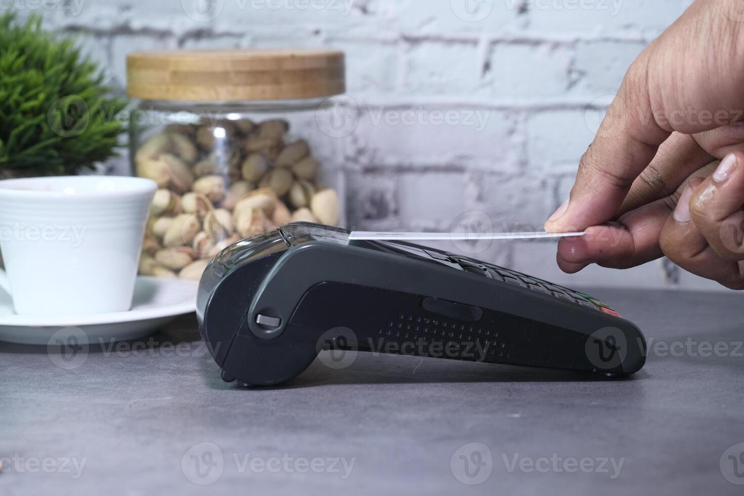 Payment terminal charging from a credit card , close up photo