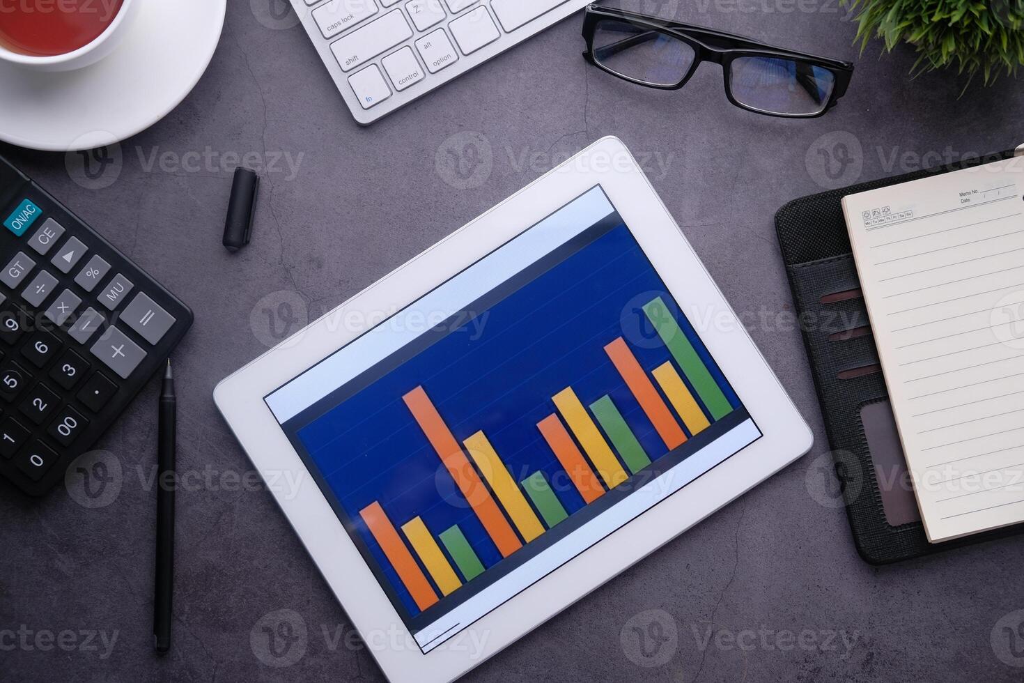 high angle view of bar chart on digital tablet on table photo