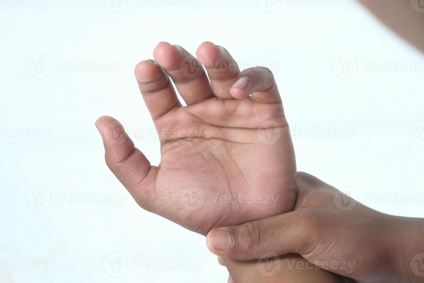 Close up man holding her wrist symptomatic Office Syndrome. photo
