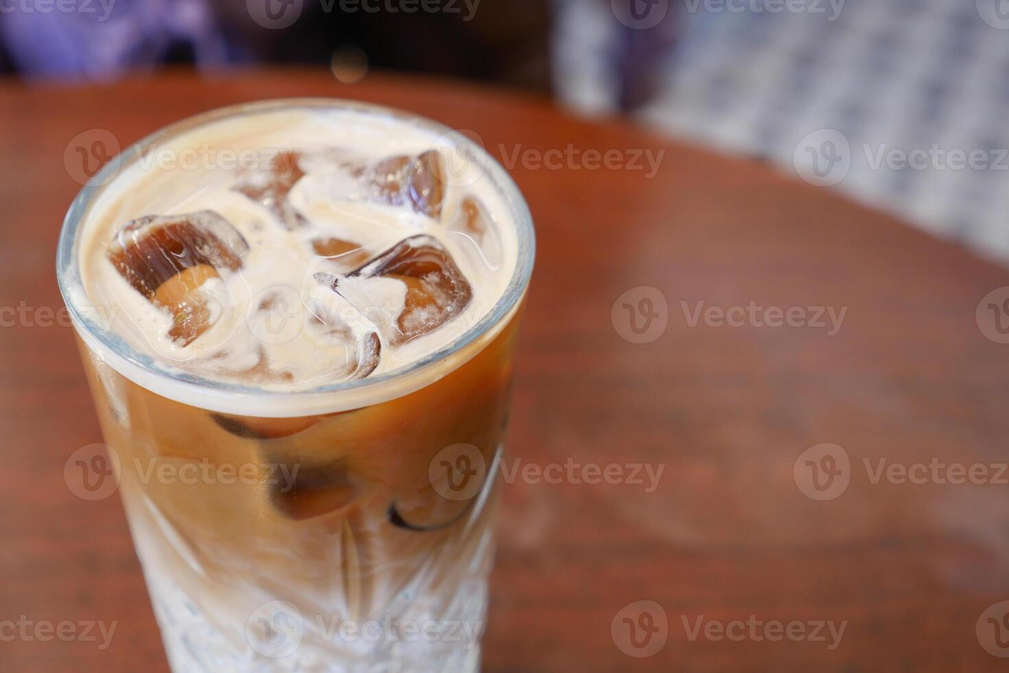 iced late in a transparent glass on cafe table photo