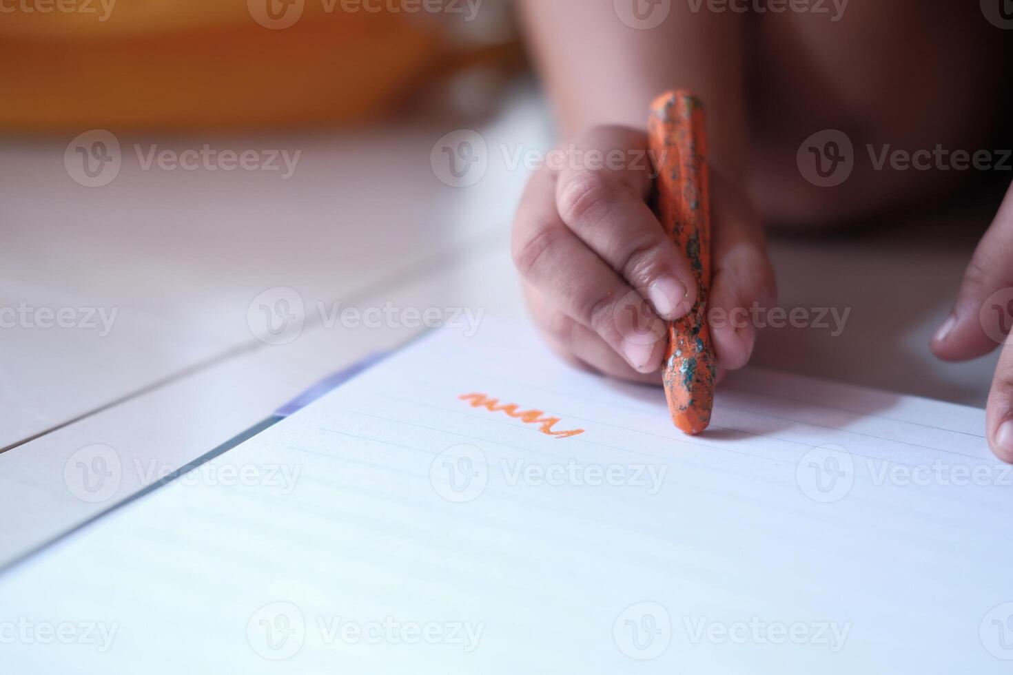 Close-up color pencil in the hand of child. photo