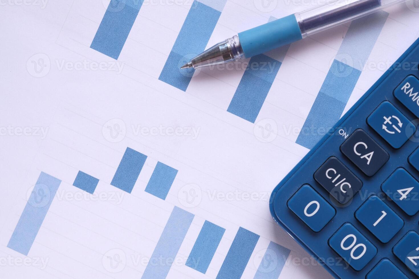 close up of financial chart and pen on table photo