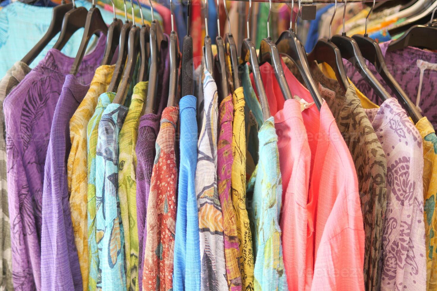 A store with a chic and neat shopping experience featuring stylish clothing on display photo