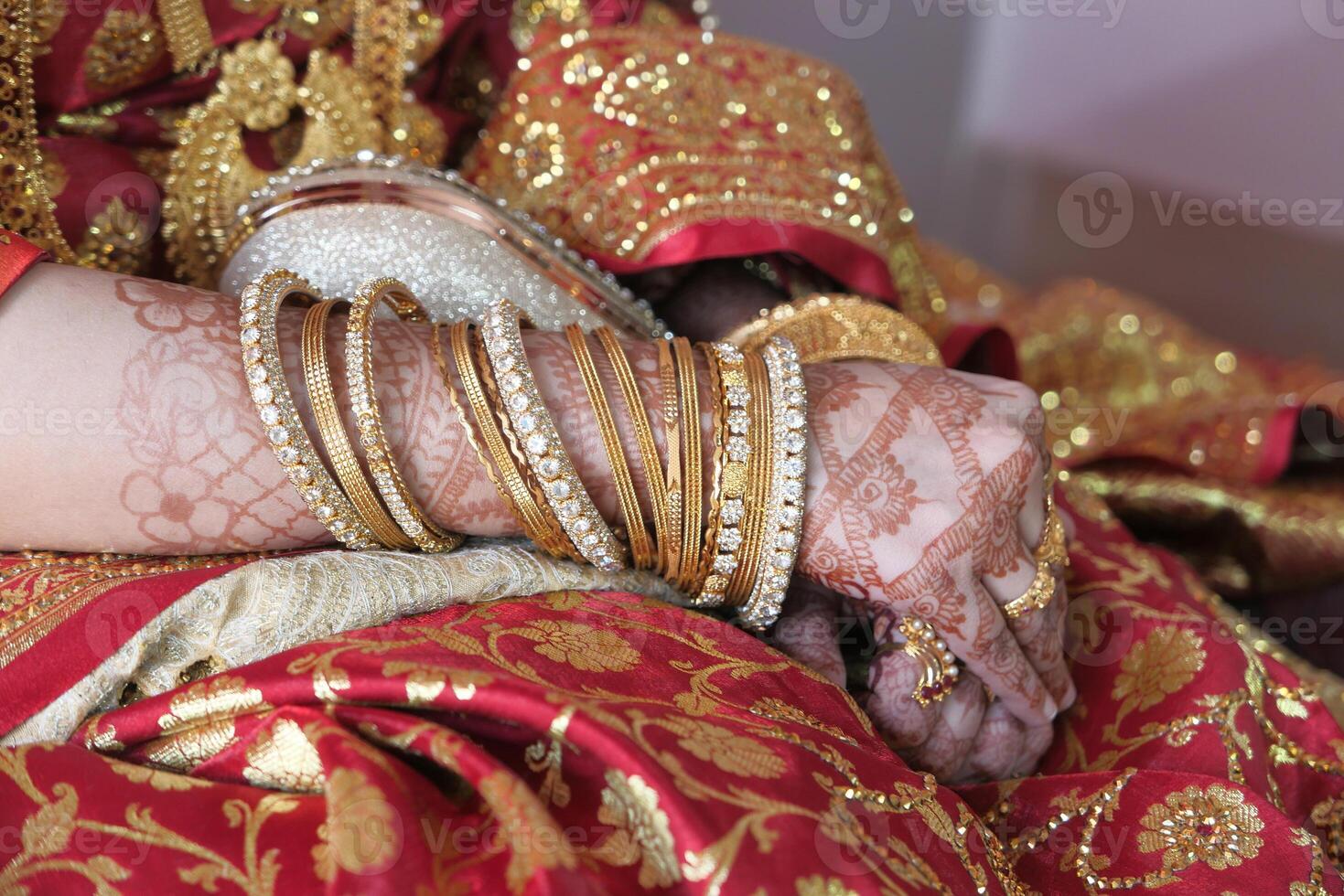 indian bride hands painted with henna close up photo