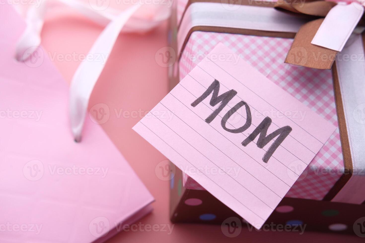mother day gift on pink background, close up. photo