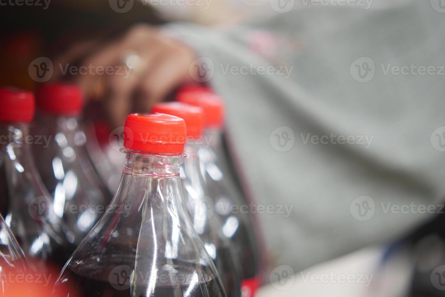 plastic bottles of soft drink in a shelf photo