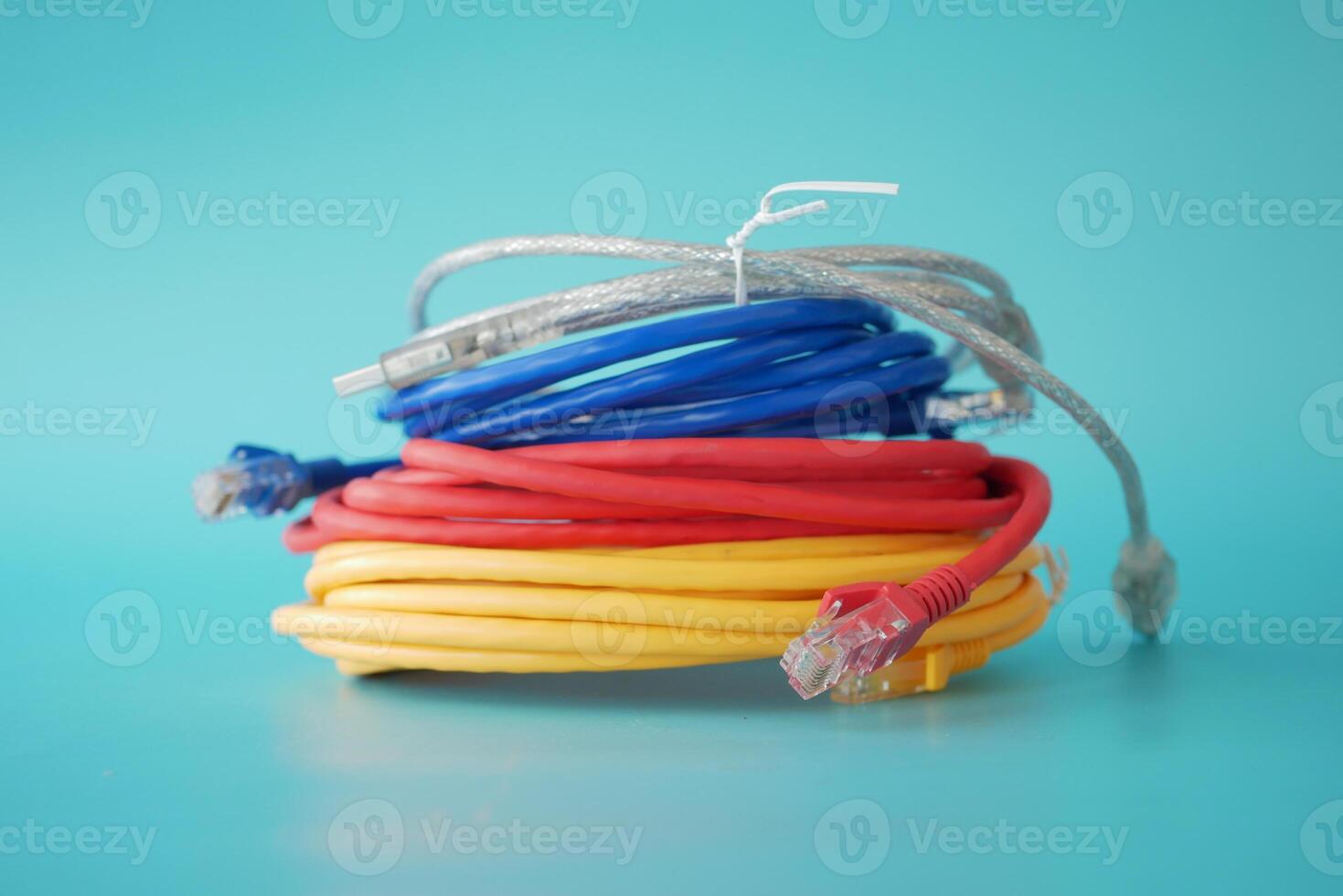 Stack of colorful elastic rubber bands on table photo