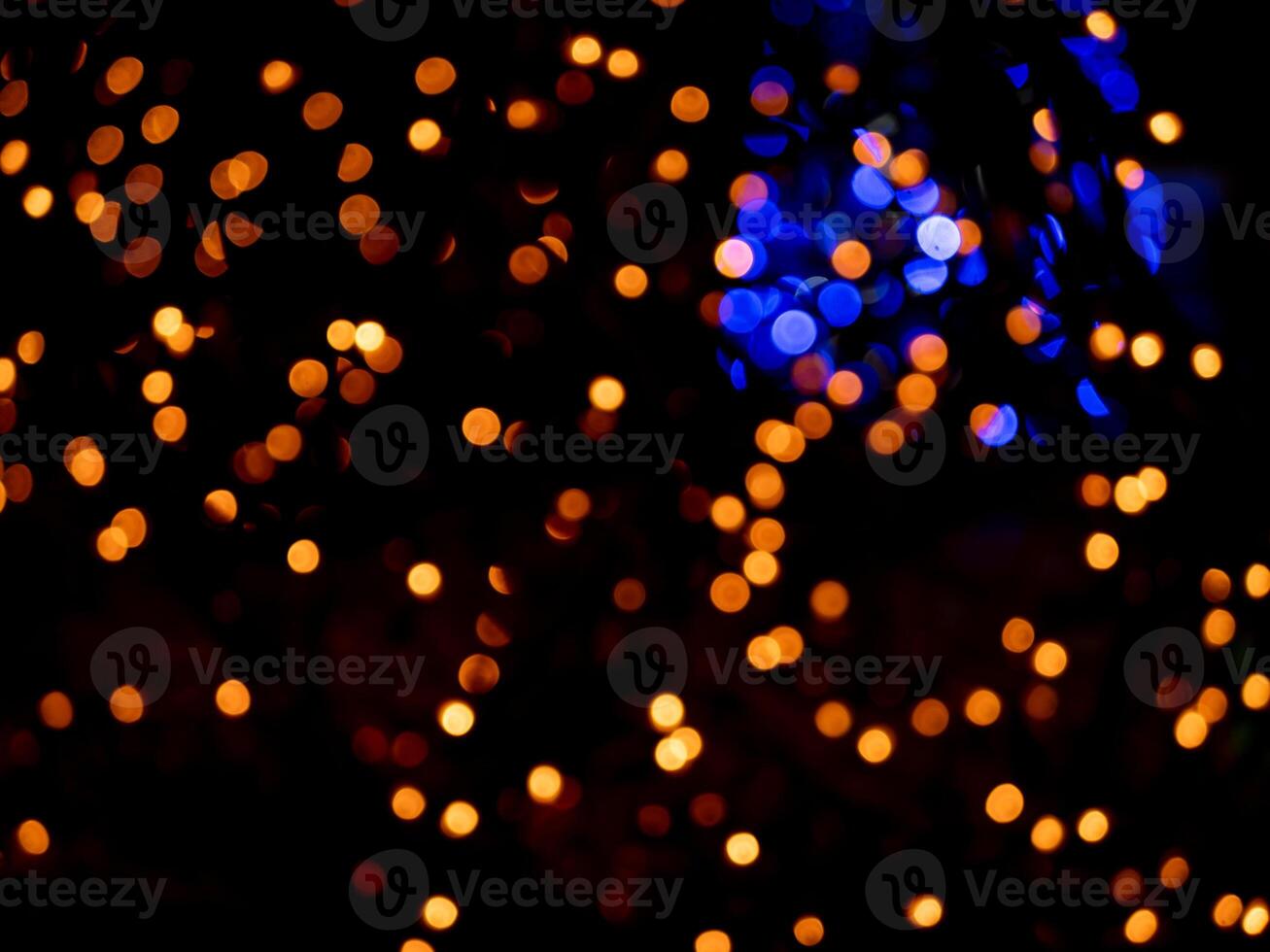abstract blurred bokeh background, bright lights on a black background photo