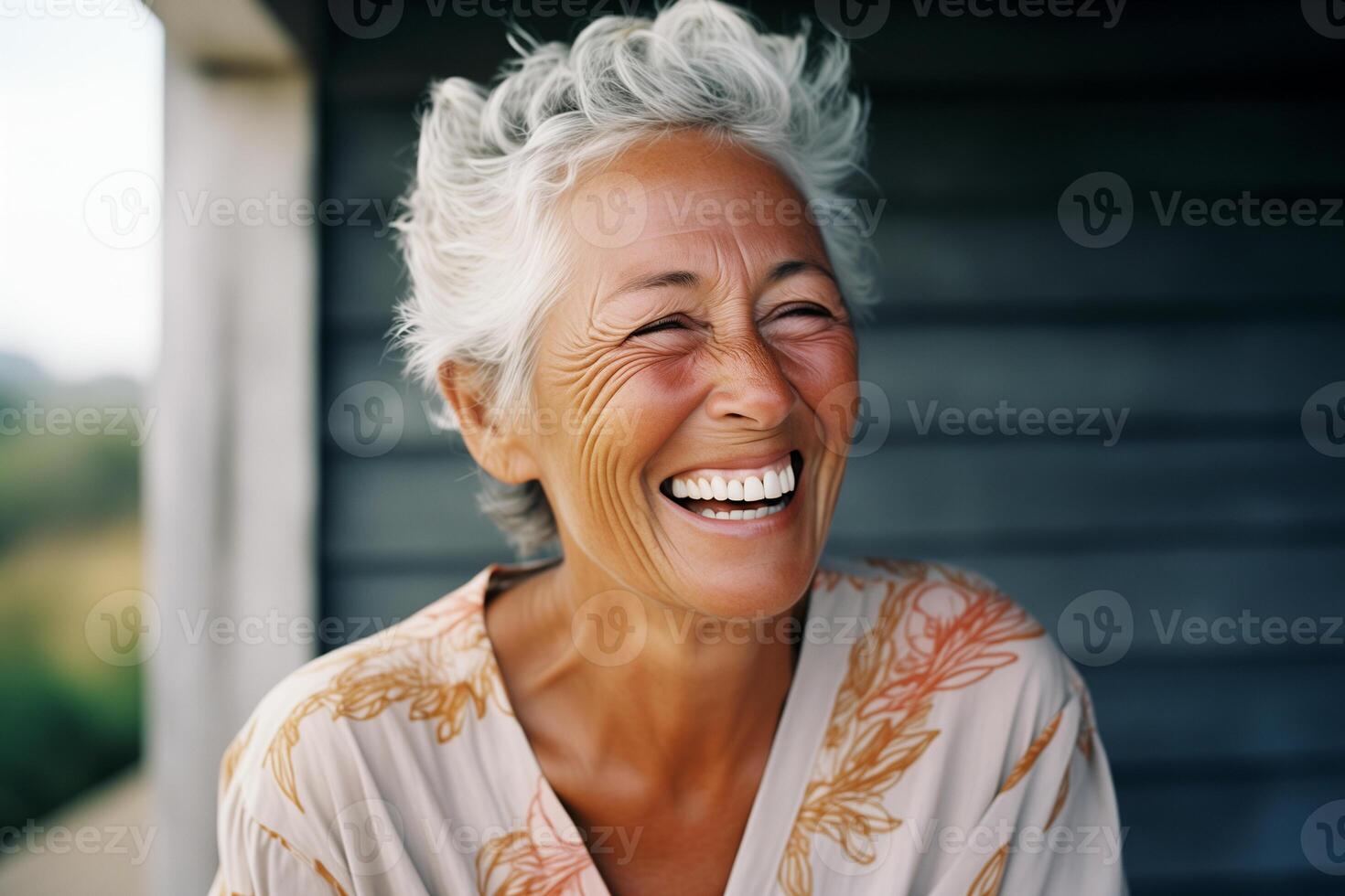 Portrait of Happy Senior Woman Laughing Outdoors photo
