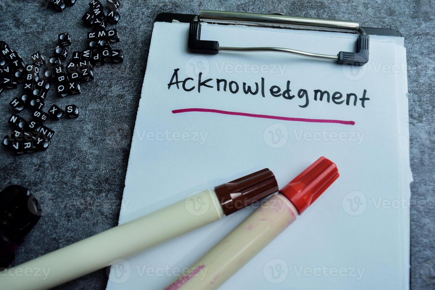 Concept of Acknowledgment write on paperwork isolated on wooden background. photo