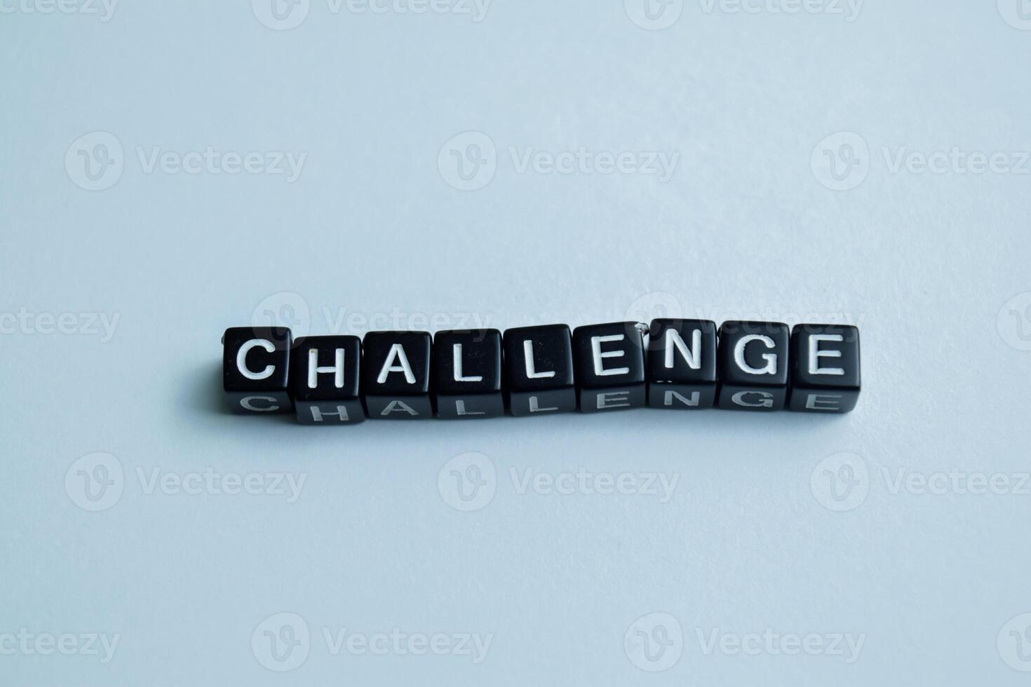 Concept of Challenge written on wooden blocks. Cross processed image on Wooden Background photo