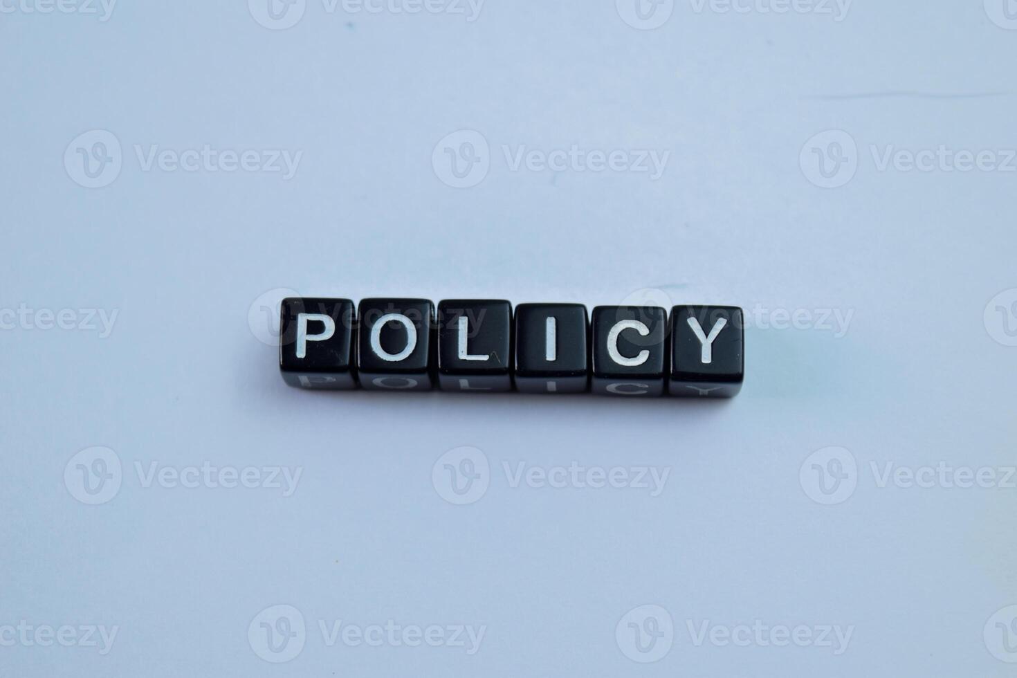 Concept of The wooden Cubes with the word Policy on wooden background. photo