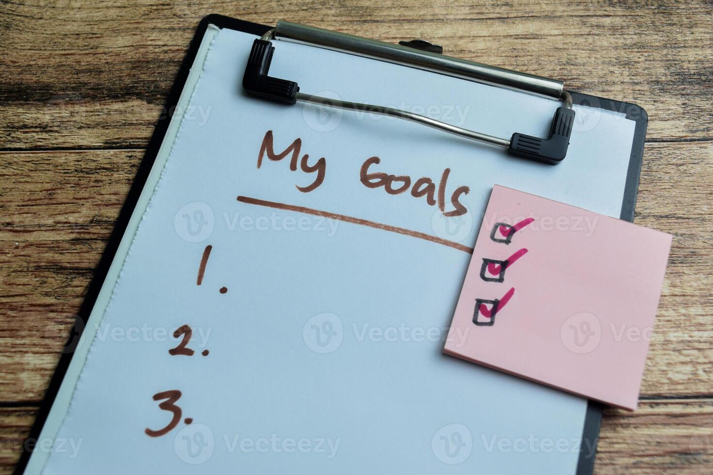 Concept of My Goals write on paperwork with Supported by an additional services isolated on wooden background. photo