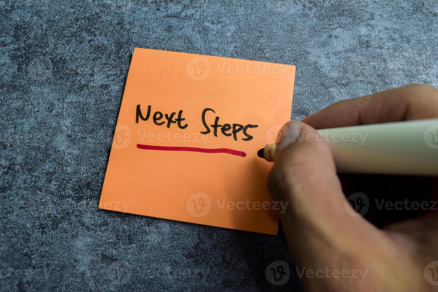 Concept of Next Steps write on sticky notes isolated on Wooden Table. photo