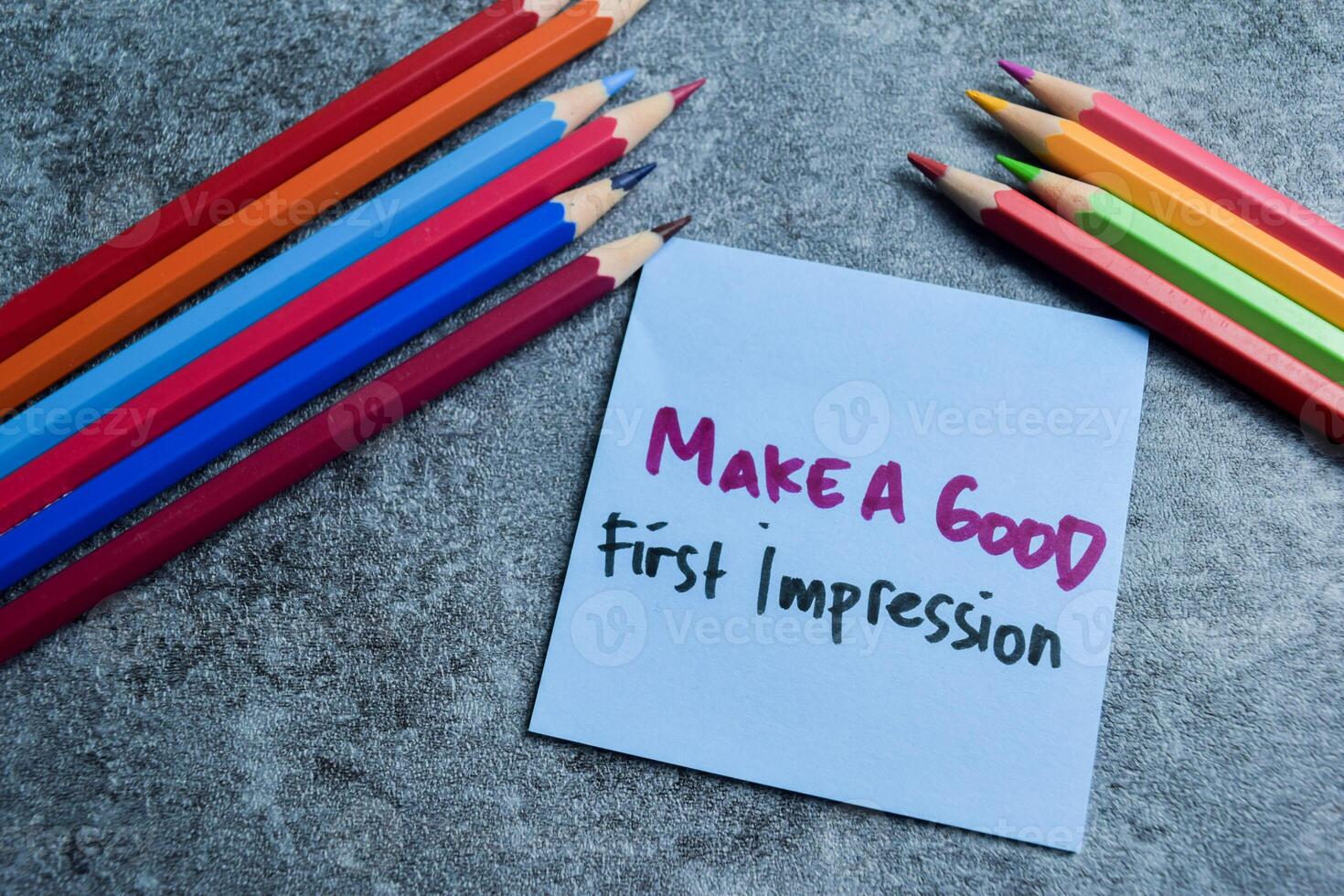 Concept of Make A Good First Impression write on sticky notes isolated on Wooden Table. photo