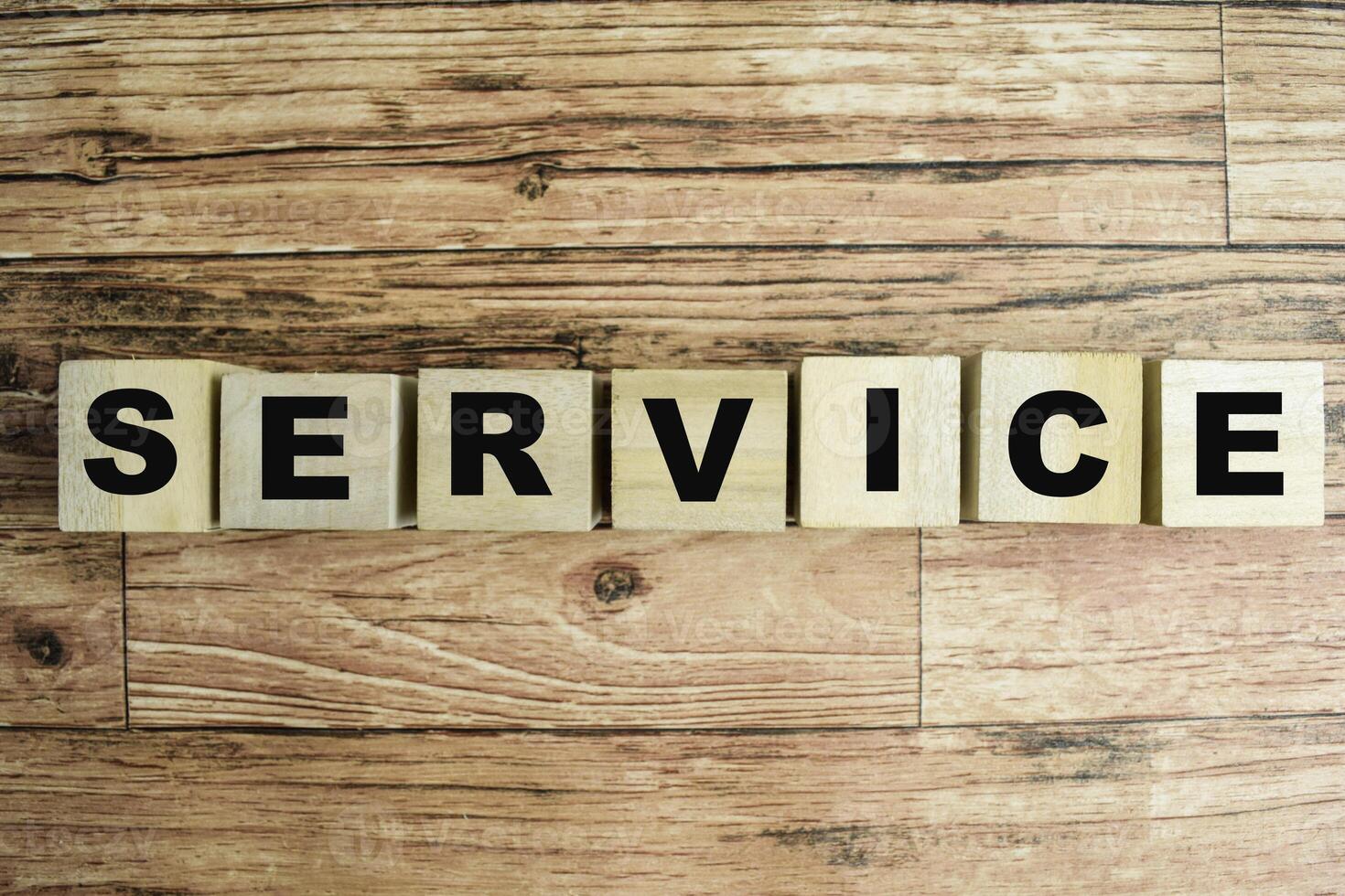 Concept of The wooden Cubes with the word Service on wooden background. photo