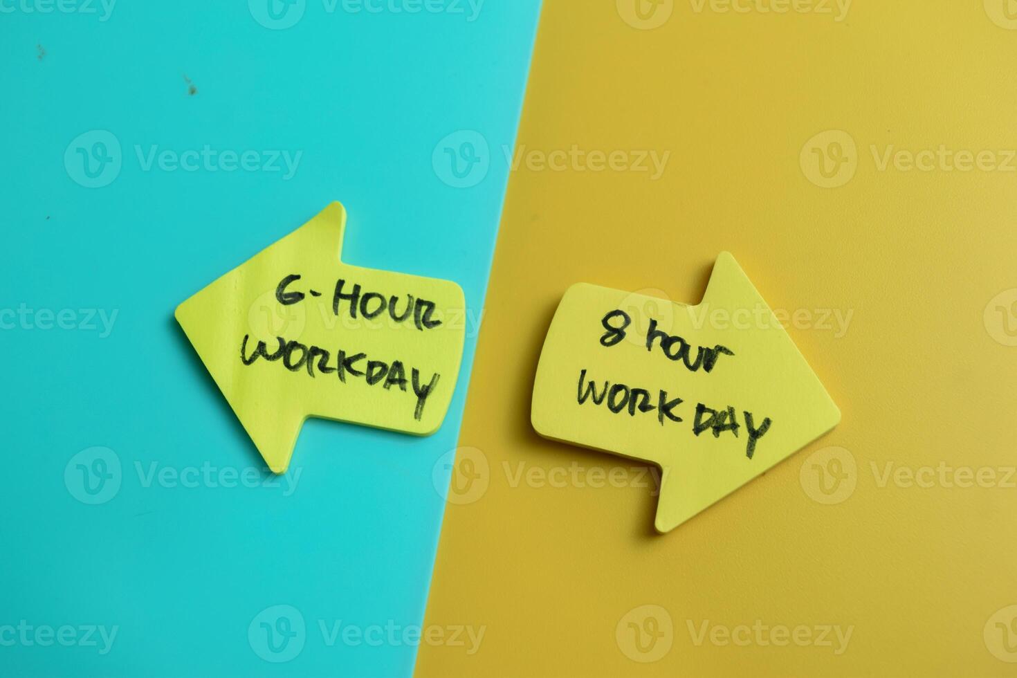 Concept of 6 Hour workday or 8 hour workday write on sticky notes isolated on Wooden Table. photo