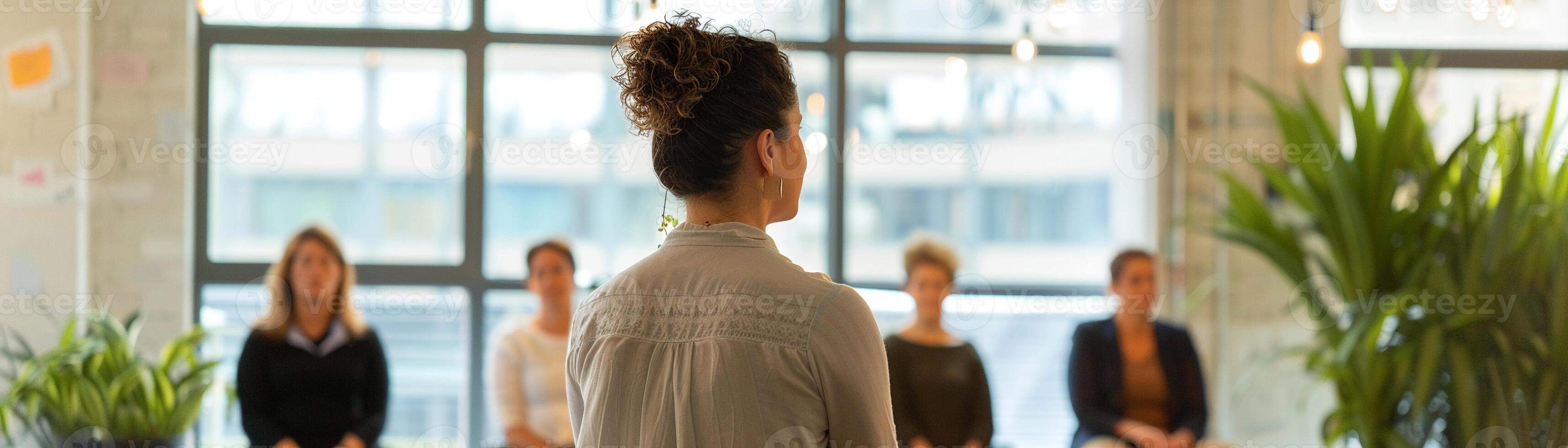 Health coach leading a corporate wellness workshop, employees learning about stress management and healthy habits photo