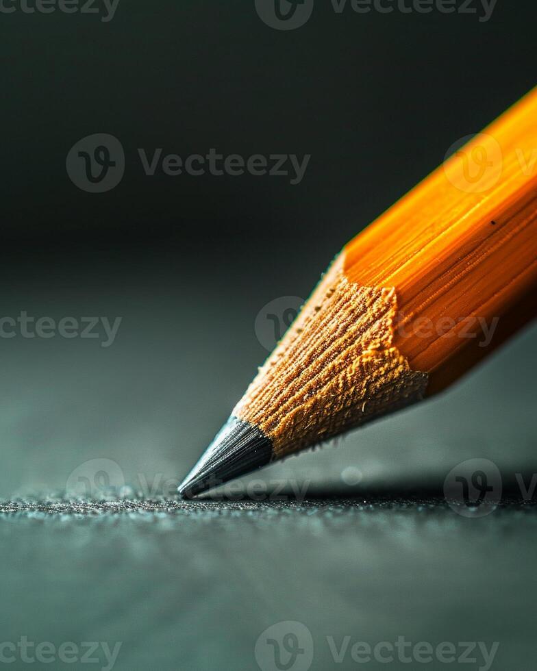 A pencil in a skilled hand sketches sharp outlines, fills them with shade, and crafts a solid, striking image photo
