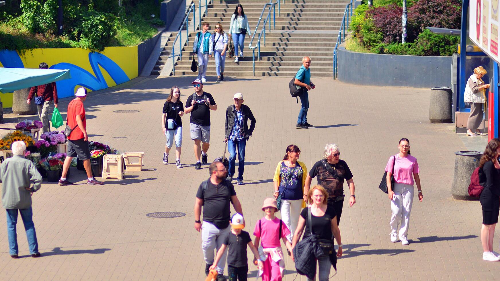 Warsaw, Poland. 8 June 2024. Crowd of people on Patelnia square in centrum city. The colloquial name. An important communication point on the city map with residents, tourists and buildings. photo