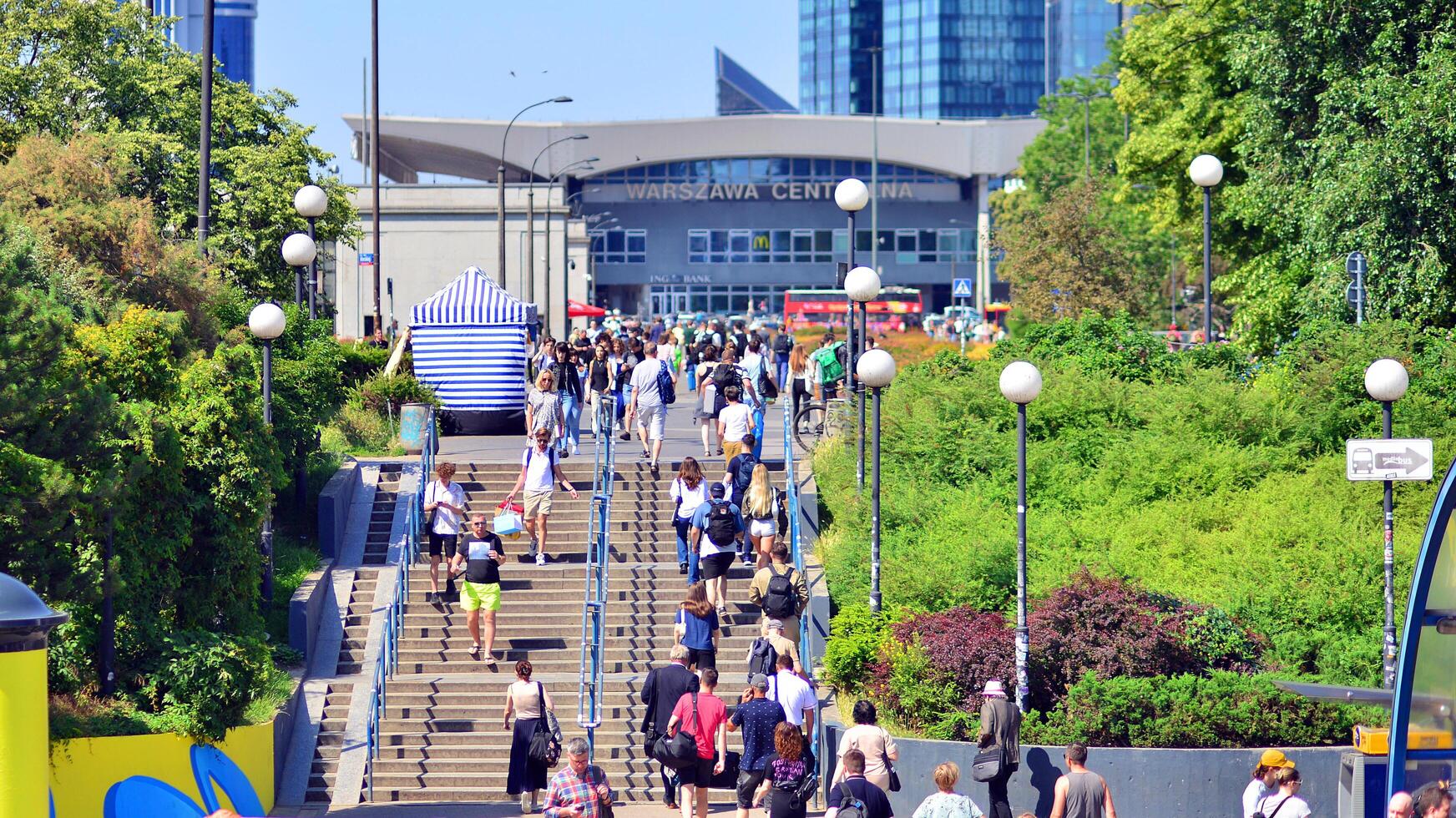 Warsaw, Poland. 8 June 2024. Crowd of people on Patelnia square in centrum city. The colloquial name. An important communication point on the city map with residents, tourists and buildings. photo