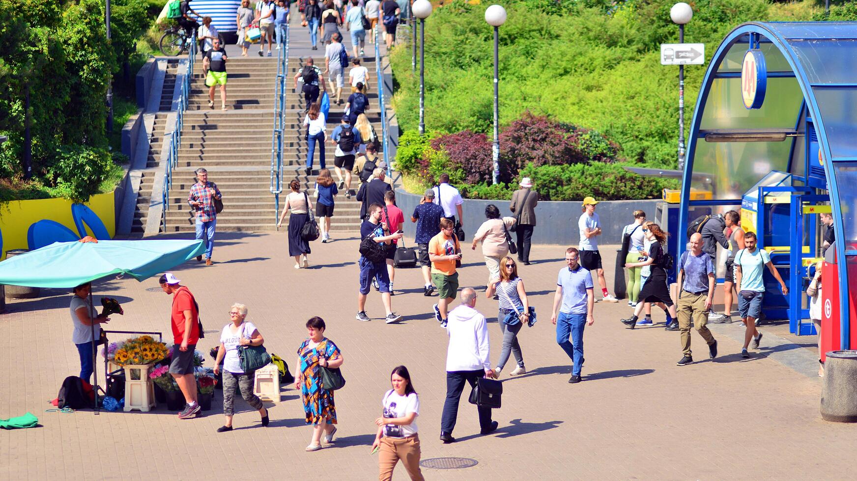 Warsaw, Poland. 8 June 2024. Crowd of people on Patelnia square in centrum city. The colloquial name. An important communication point on the city map with residents, tourists and buildings. photo