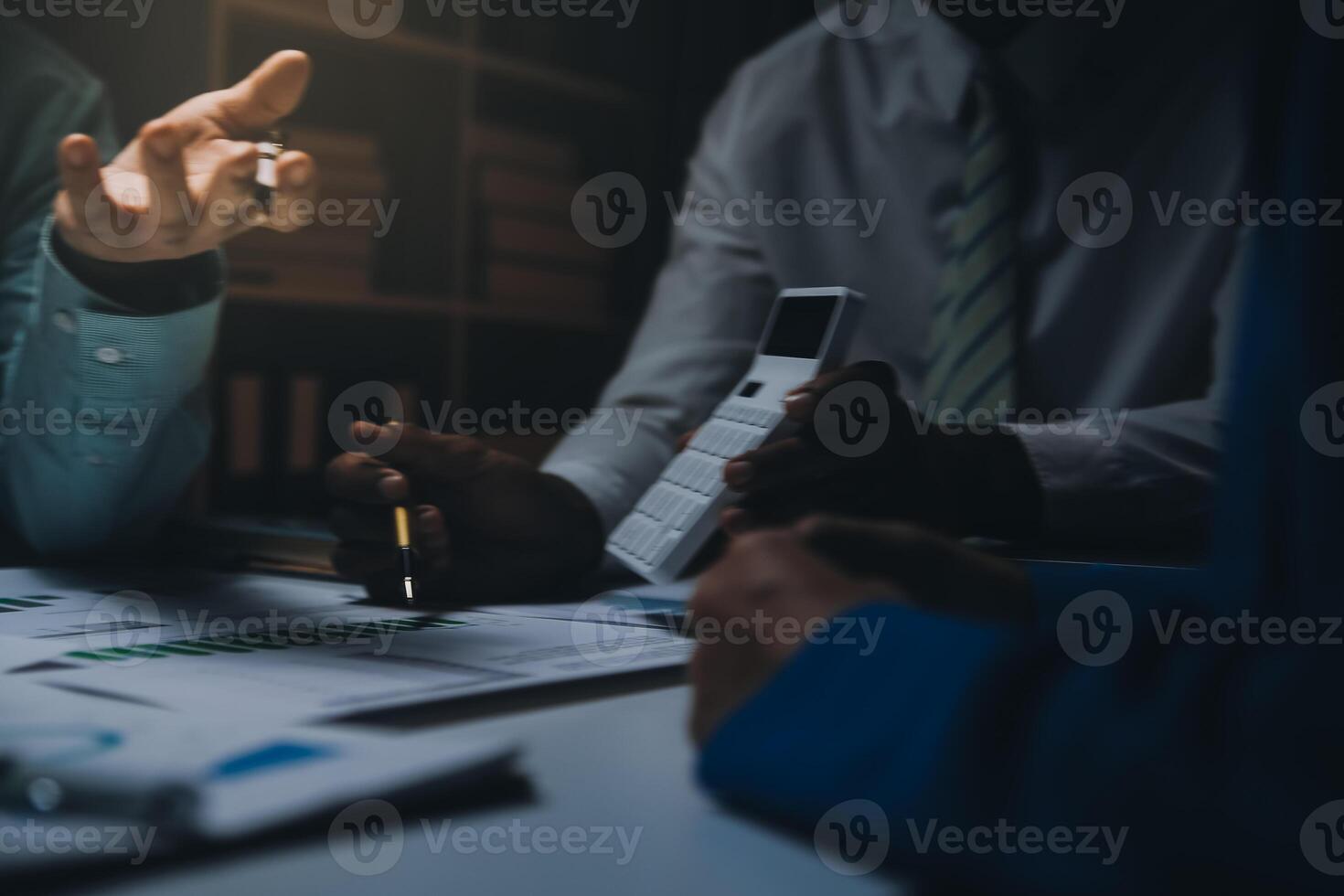 Business team meeting present, investor colleagues consultation and conference new strategy plan business and market growth on financial document graph report, Meeting and Talking. photo