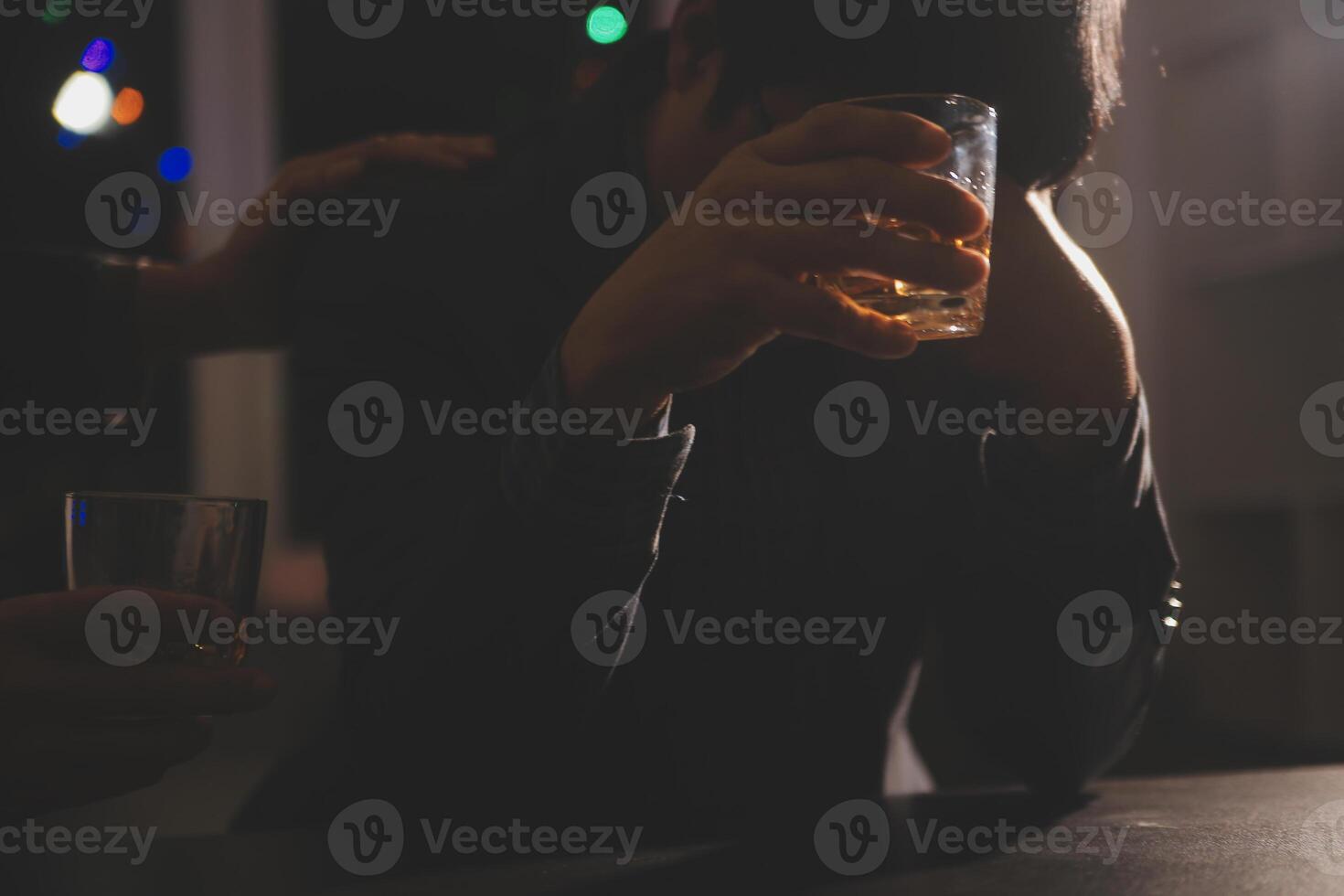 Celebration night, pour whiskey into a glass. Give to friends who come to celebrate photo