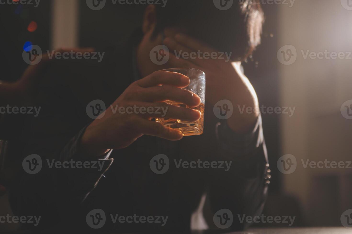 Celebration night, pour whiskey into a glass. Give to friends who come to celebrate photo