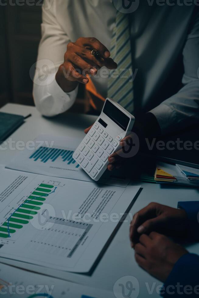 Business team meeting present, investor colleagues consultation and conference new strategy plan business and market growth on financial document graph report, Meeting and Talking. photo