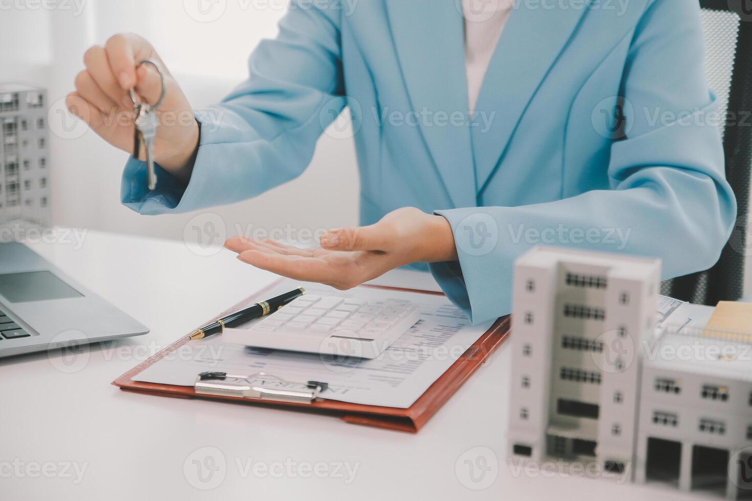 Real estate agent talked about the terms of the home purchase agreement and asked the customer to sign the documents to make the contract legally, Home sales and home insurance concept. photo