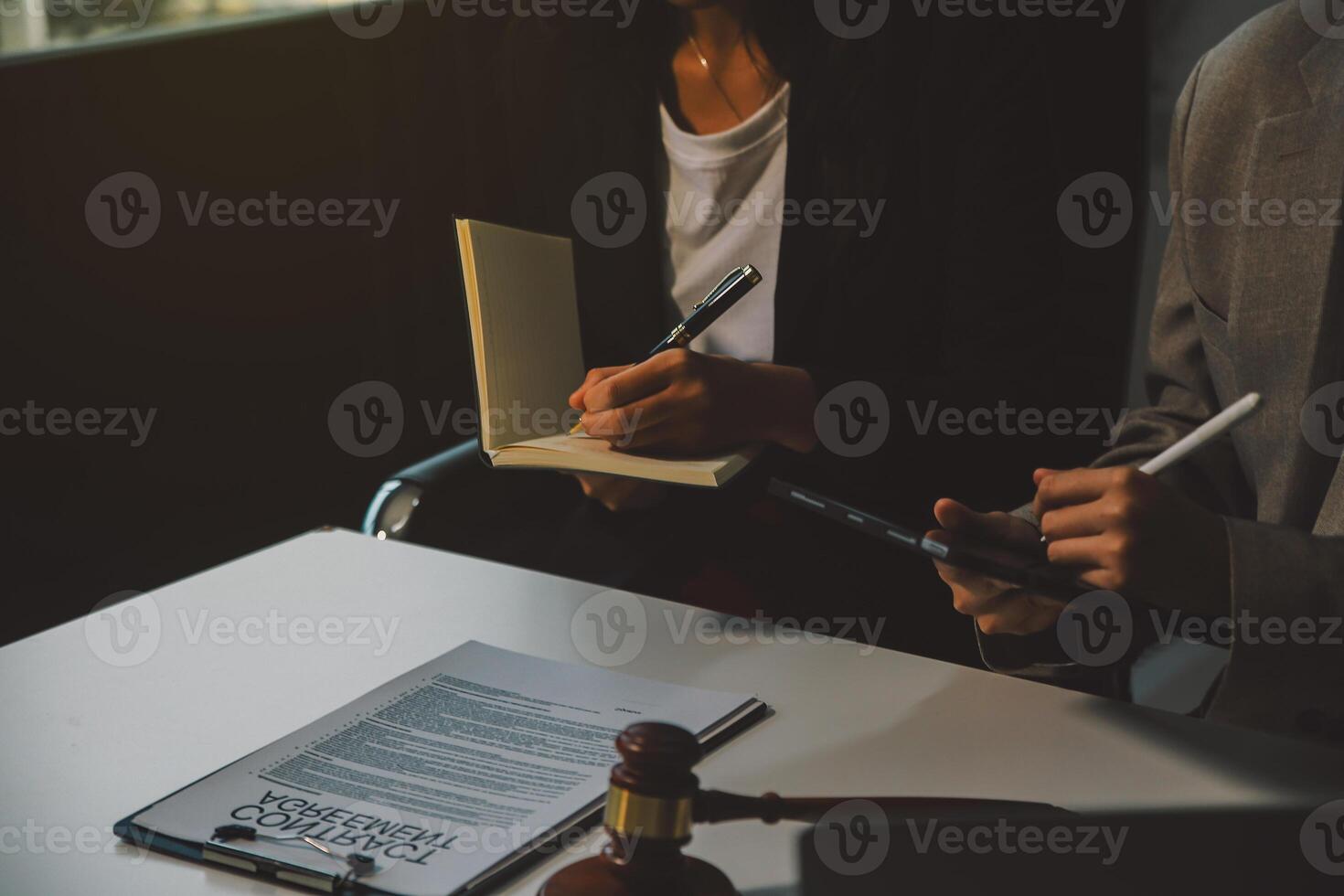 Lawyer, legal advisor, businessman brainstorming information on agreement details Business contracts in legal processing books for accuracy in contract documents. joint financial investment. photo