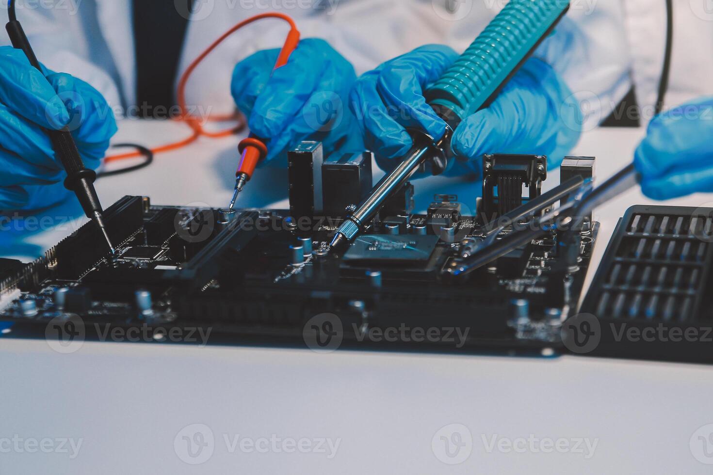 Close up of Technician measuring voltage electronic circuit board television, Service after sale fix electric equipment within insurance. photo