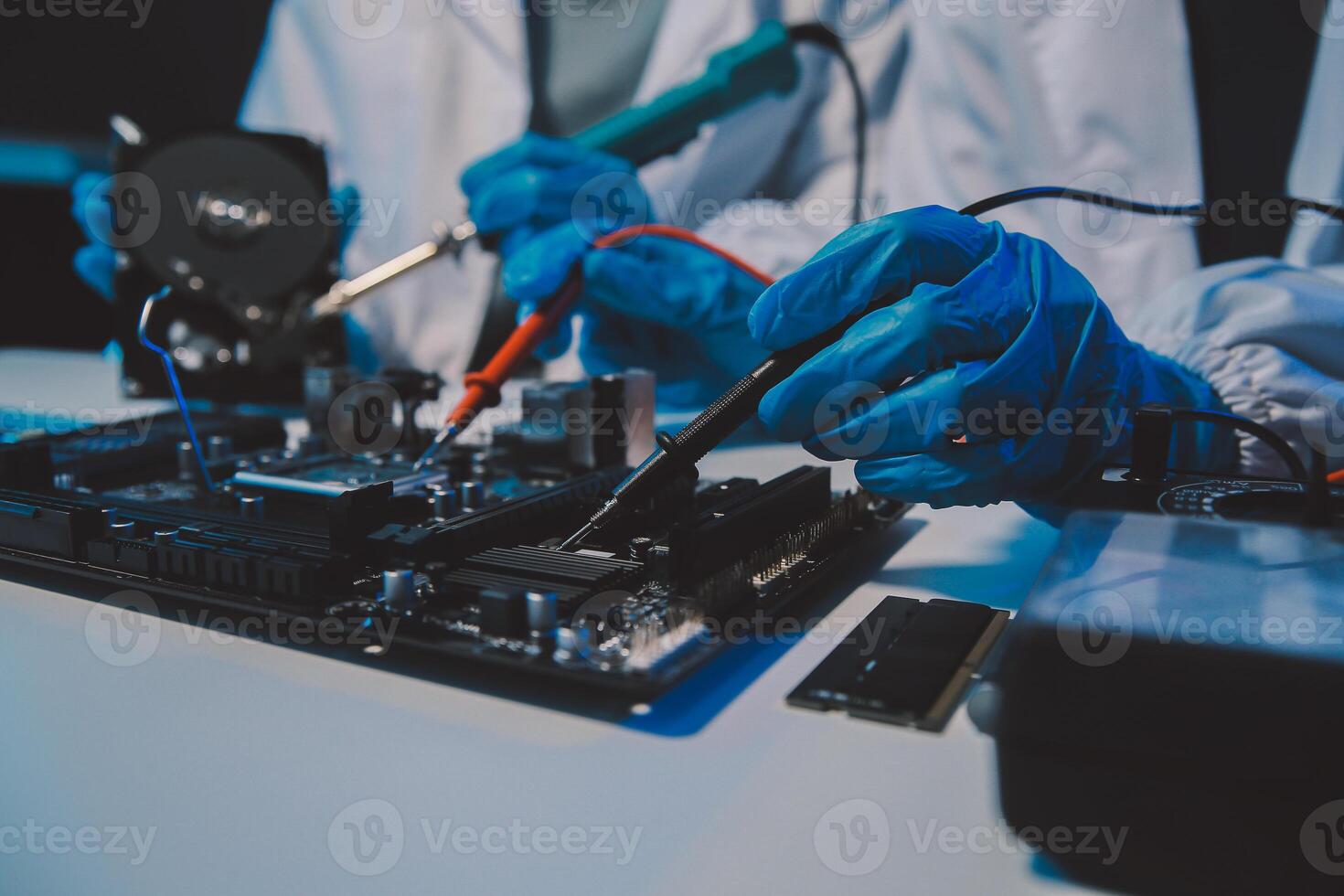 Close up of Technician measuring voltage electronic circuit board television, Service after sale fix electric equipment within insurance. photo