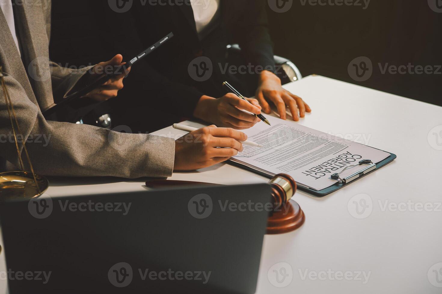 Lawyer, legal advisor, businessman brainstorming information on agreement details Business contracts in legal processing books for accuracy in contract documents. joint financial investment. photo