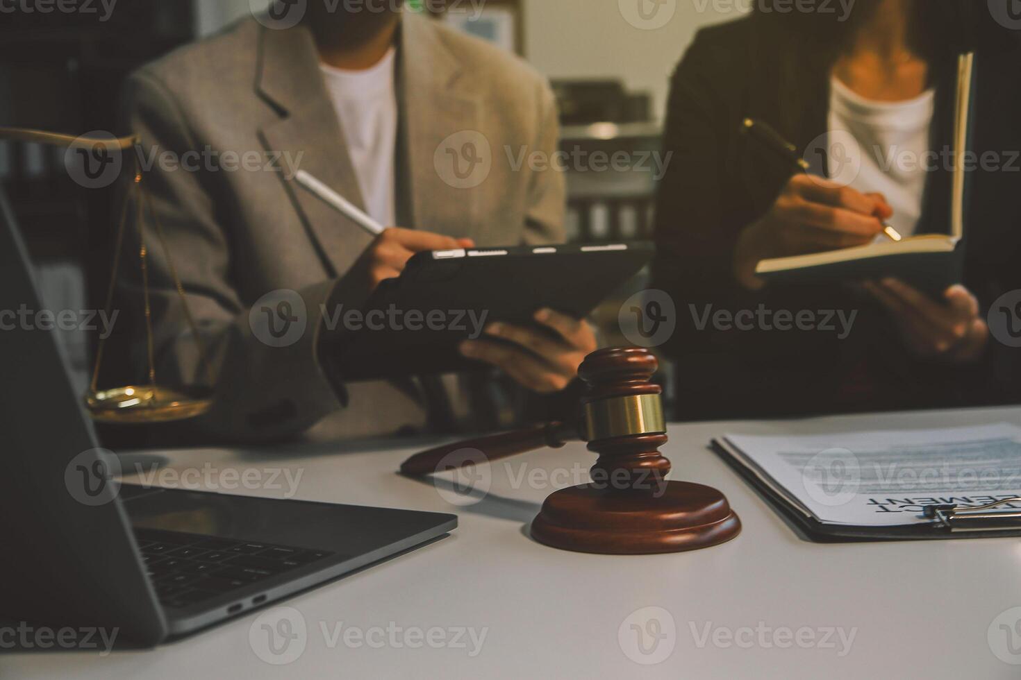 Lawyer, legal advisor, businessman brainstorming information on agreement details Business contracts in legal processing books for accuracy in contract documents. joint financial investment. photo