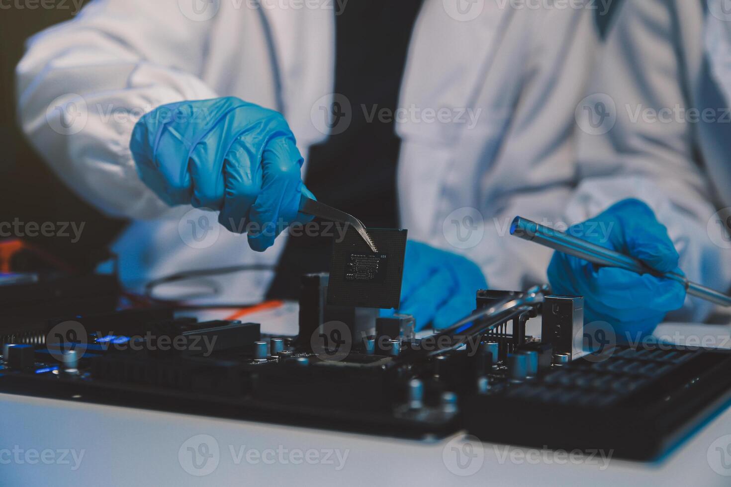 Close up of Technician measuring voltage electronic circuit board television, Service after sale fix electric equipment within insurance. photo