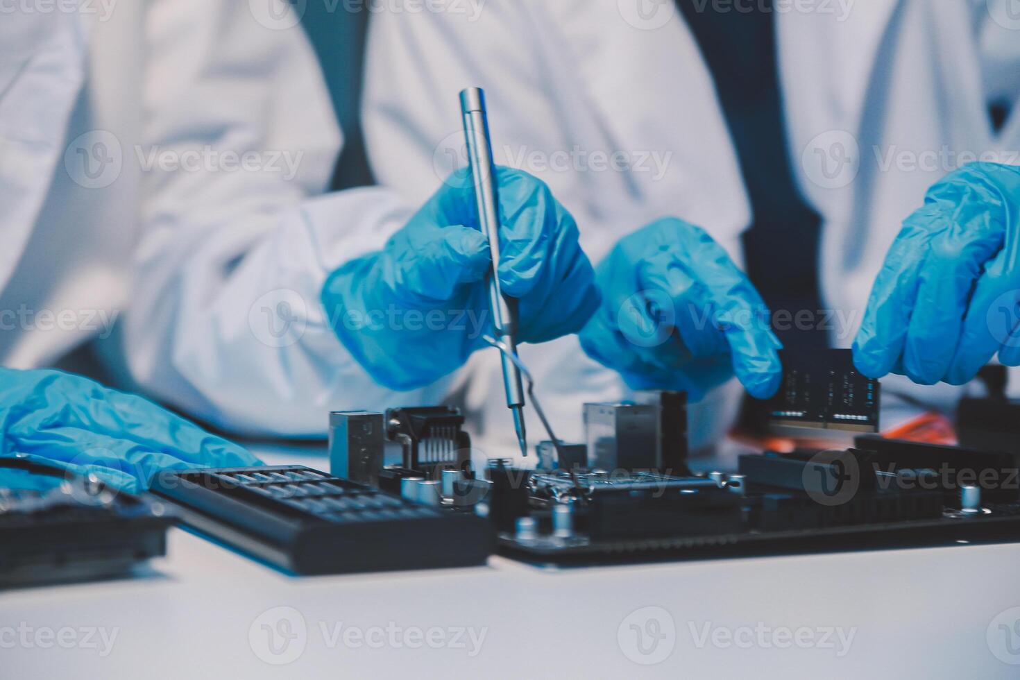 Close up of Technician measuring voltage electronic circuit board television, Service after sale fix electric equipment within insurance. photo