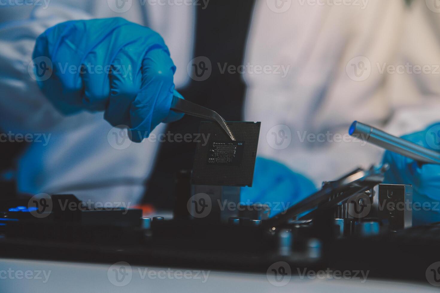 Close up of Technician measuring voltage electronic circuit board television, Service after sale fix electric equipment within insurance. photo