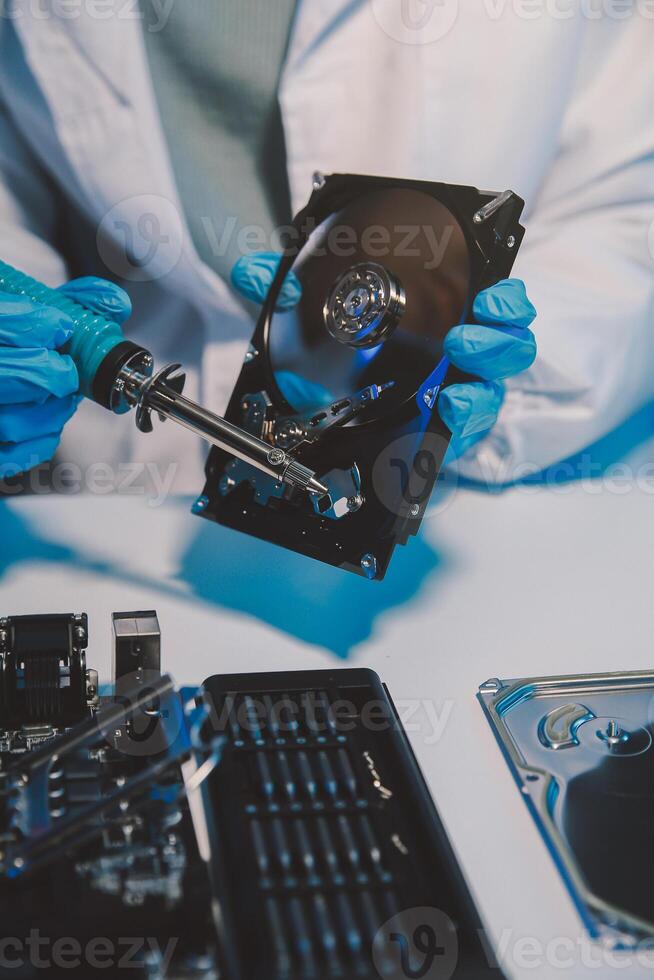 Close up of Technician measuring voltage electronic circuit board television, Service after sale fix electric equipment within insurance. photo