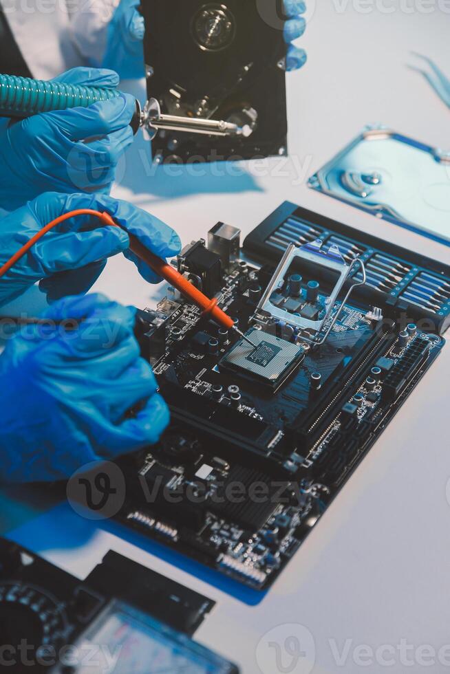 Close up of Technician measuring voltage electronic circuit board television, Service after sale fix electric equipment within insurance. photo