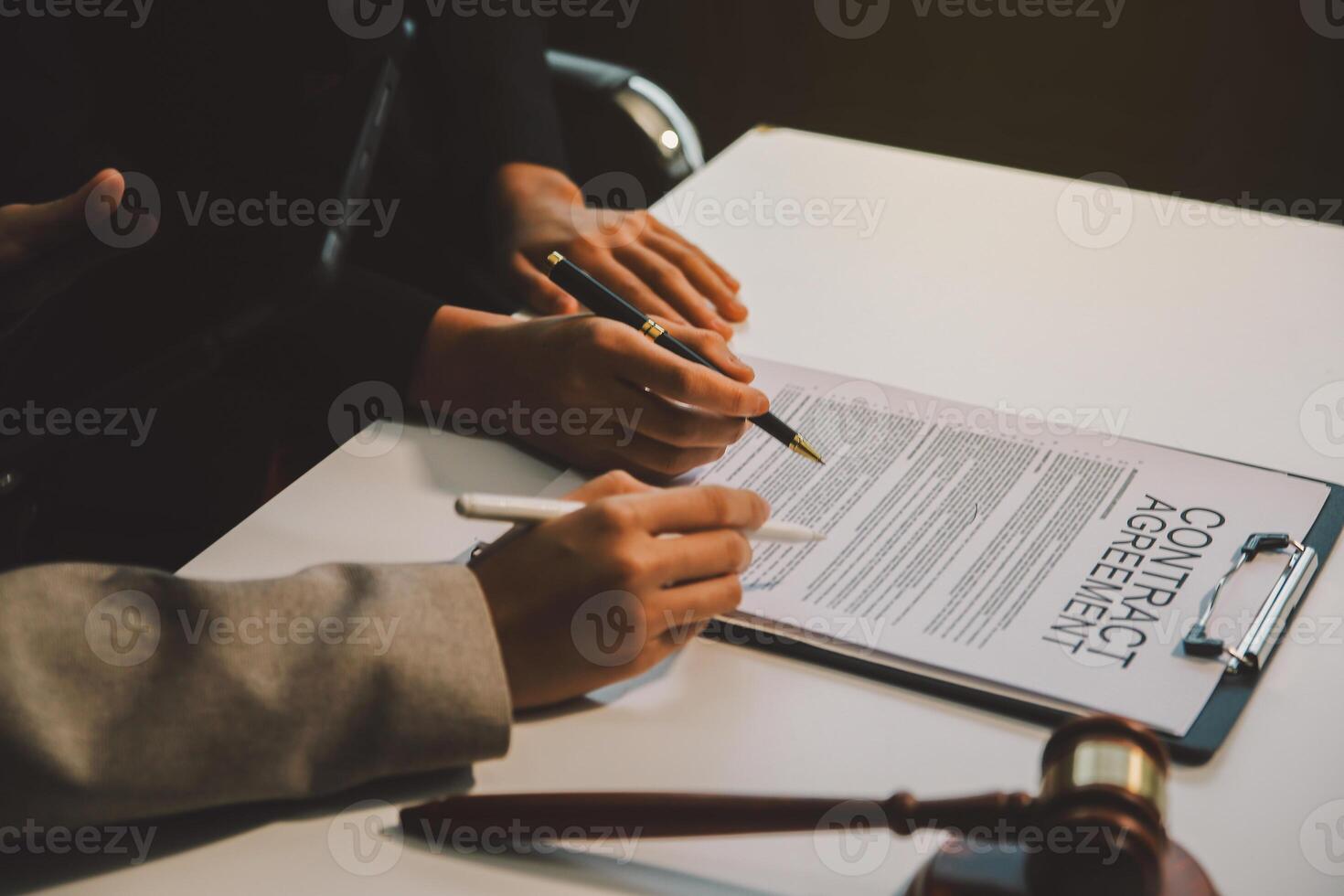 Lawyer, legal advisor, businessman brainstorming information on agreement details Business contracts in legal processing books for accuracy in contract documents. joint financial investment. photo
