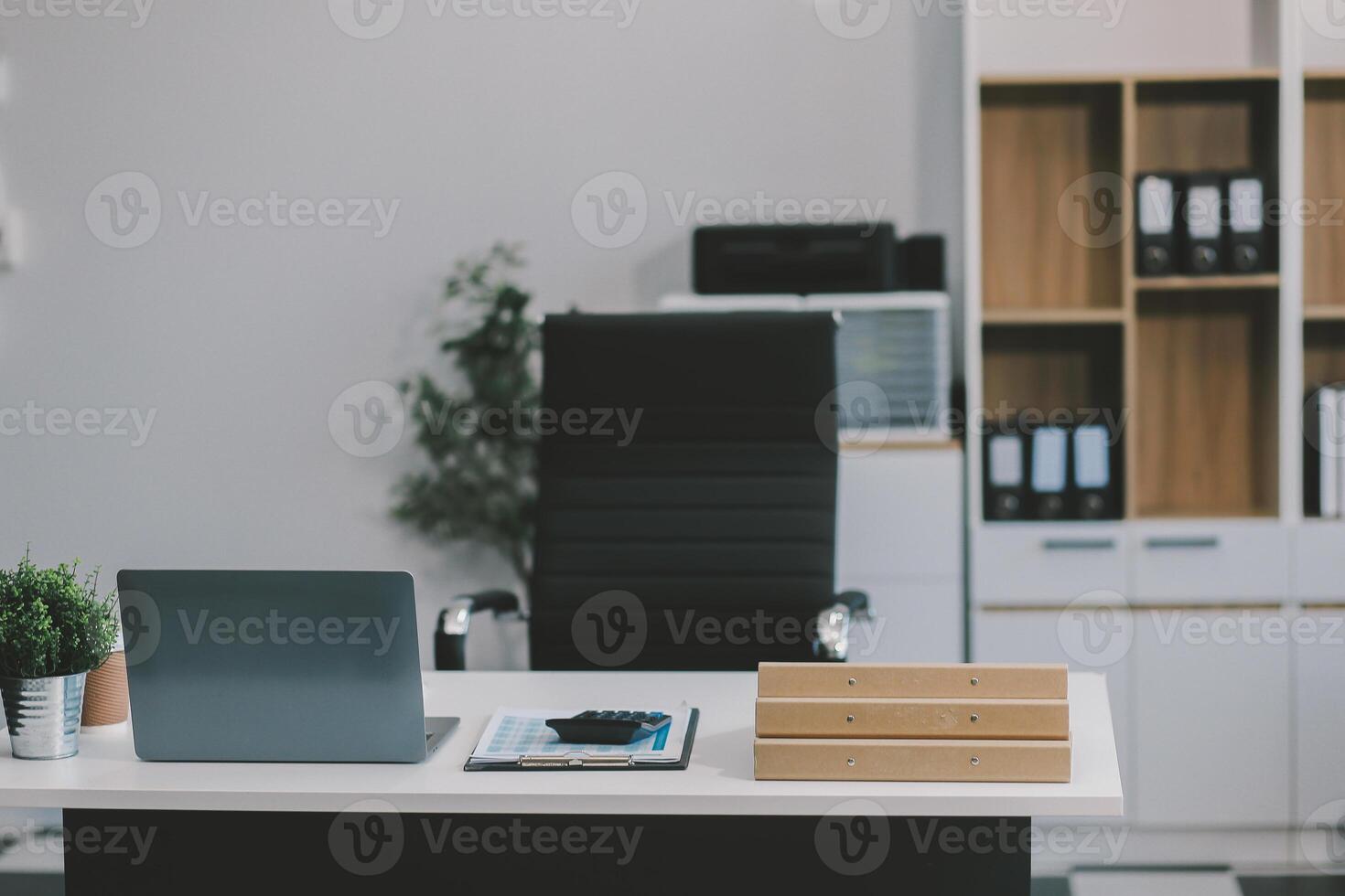 Stylish workspace with desktop computer, office supplies, houseplant and books at office. desk work concept. photo