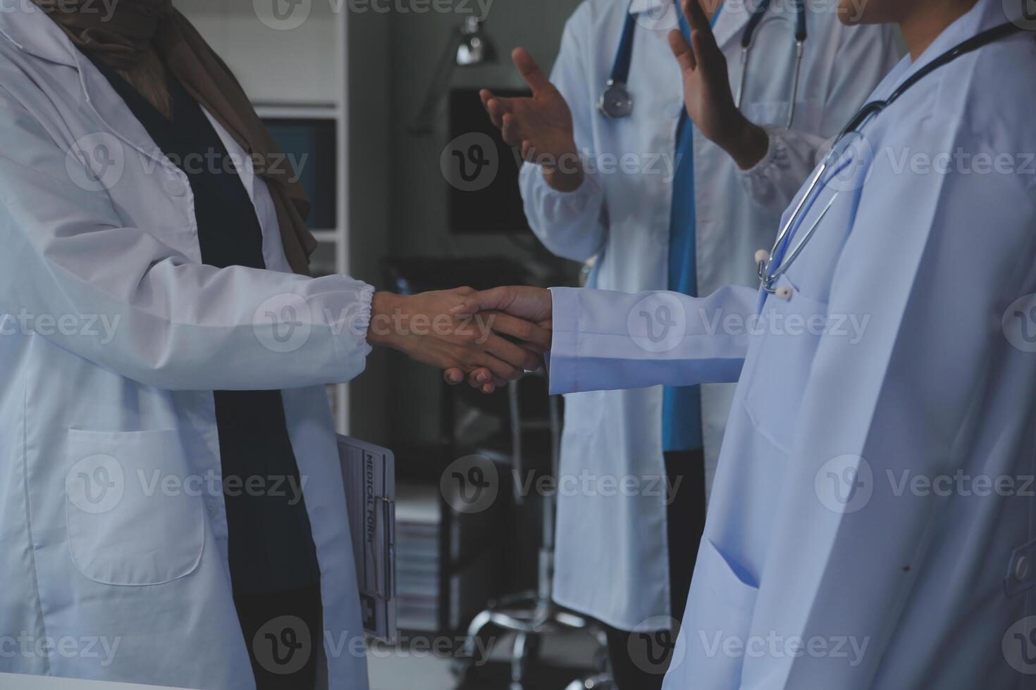 The medical team joins hands and works togetherGroup of scientists joining hands to create experimental works that meet their goals or the success of the trials that have been completed photo