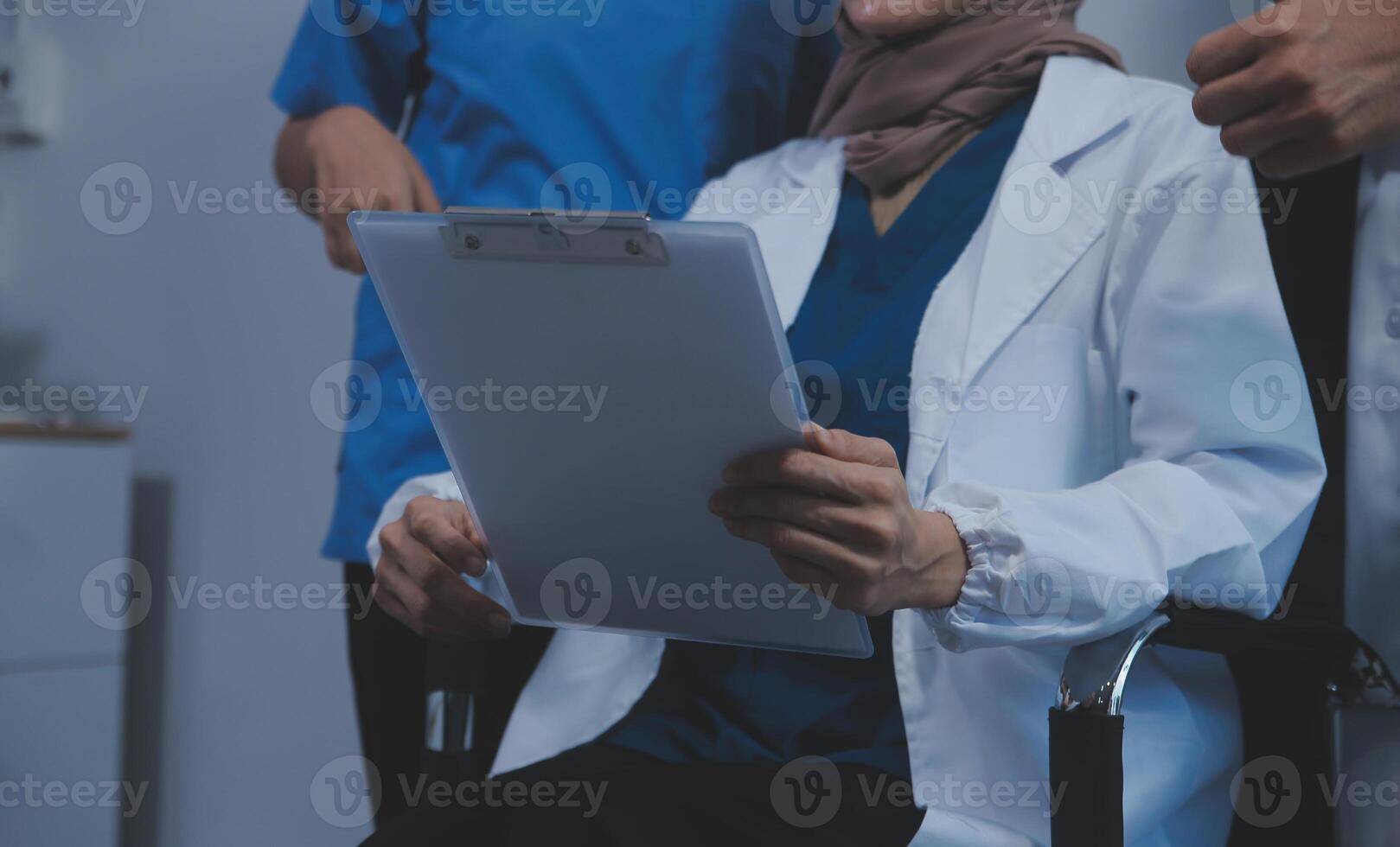 Quality healthcare is all about putting the patient at the centre. Shot of a group of medical practitioners having a discussion in a hospital. photo