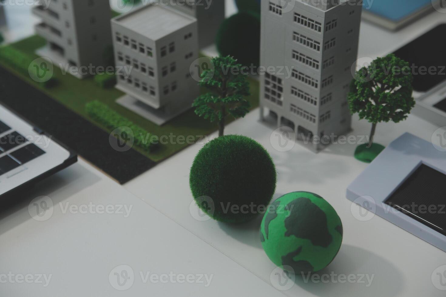 Business people having consultation about wind energy at company office. Business team discussing about windmill and alternative green energy. Executive meeting at modern office photo