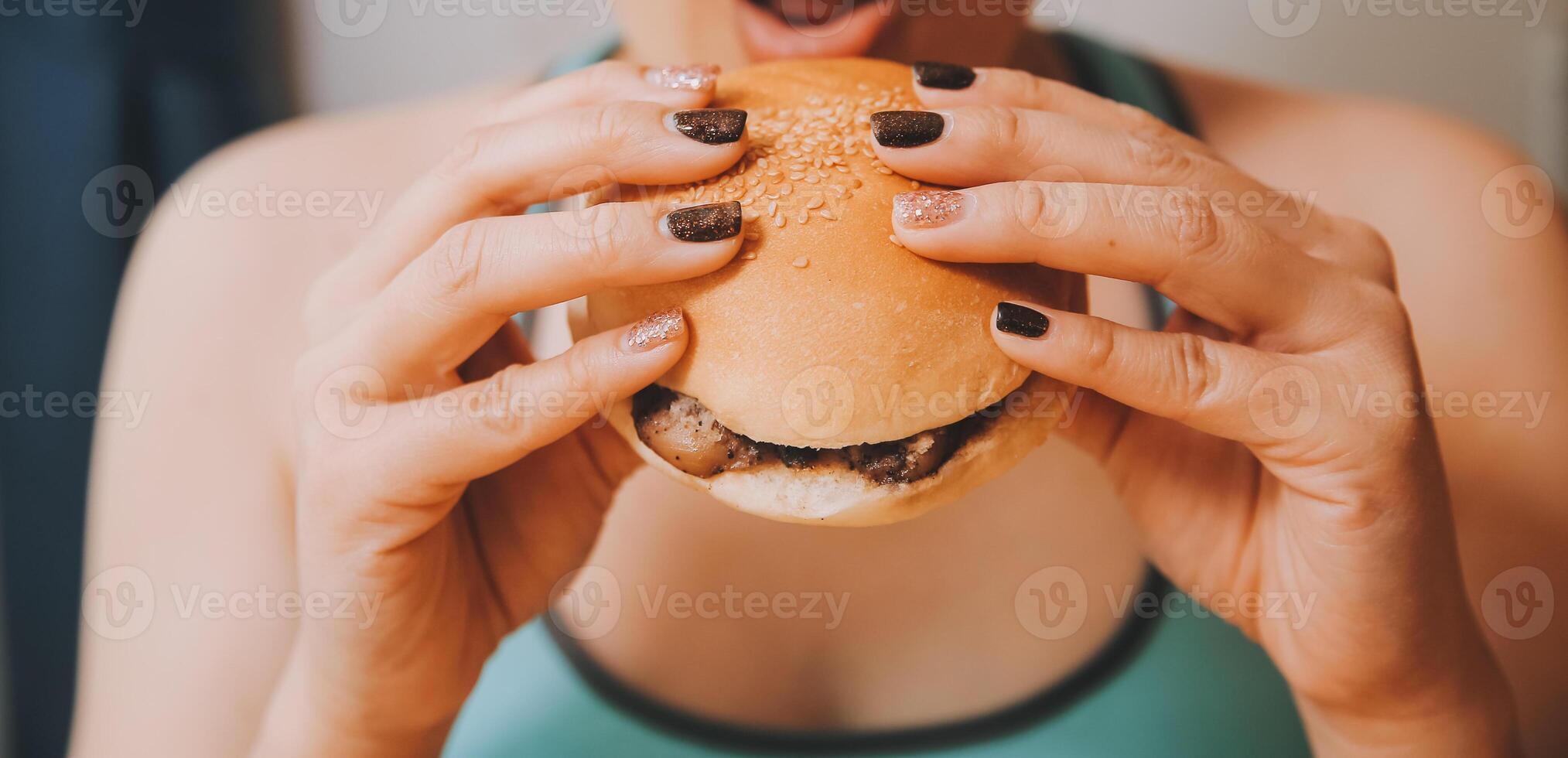 Binge eating disorder concept with woman eating fast food burger, fired chicken , donuts and desserts photo