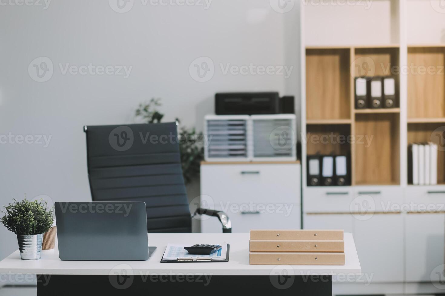 Stylish workspace with desktop computer, office supplies, houseplant and books at office. desk work concept. photo