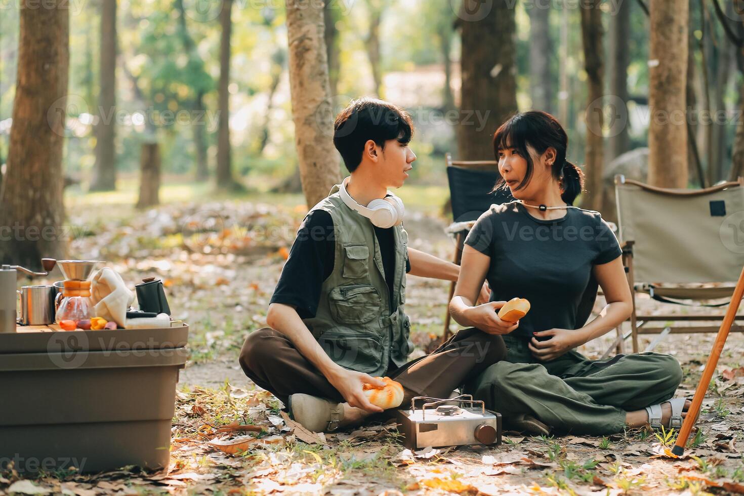 Asian couple sweet in tent inside on they camping trip, traveller relax and sleep togather in out door and camping trip photo
